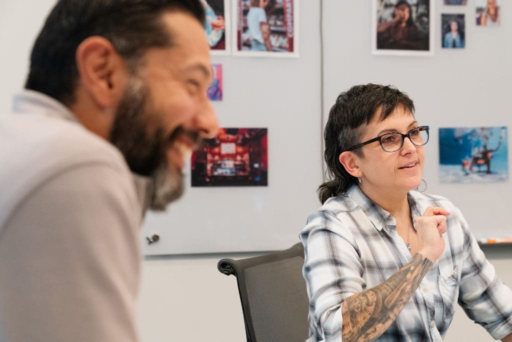 EFM Creative Agency Team Happily Discussing Project Strategy.